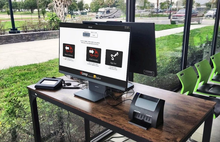 tdLoop kiosk at a warehouse gate with Check In (Unload), Check In (Load), and Sign Out options, a signature pad, and an ID scanner